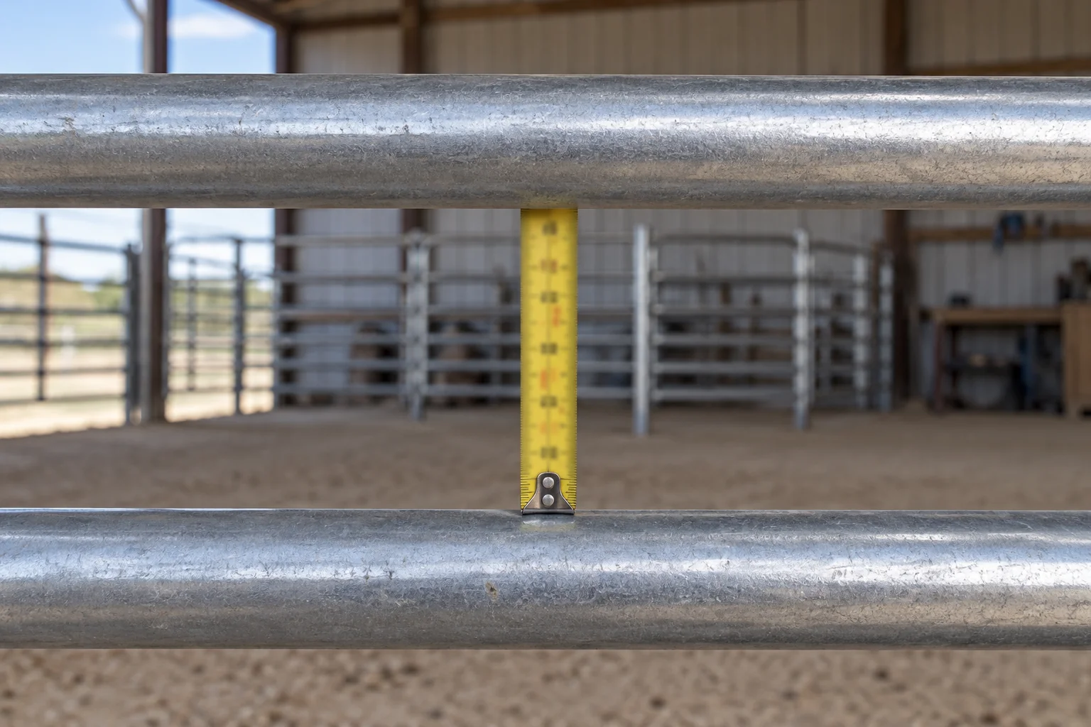 Conceptual measuring tape spanning the clear opening between two horizontal steel rails